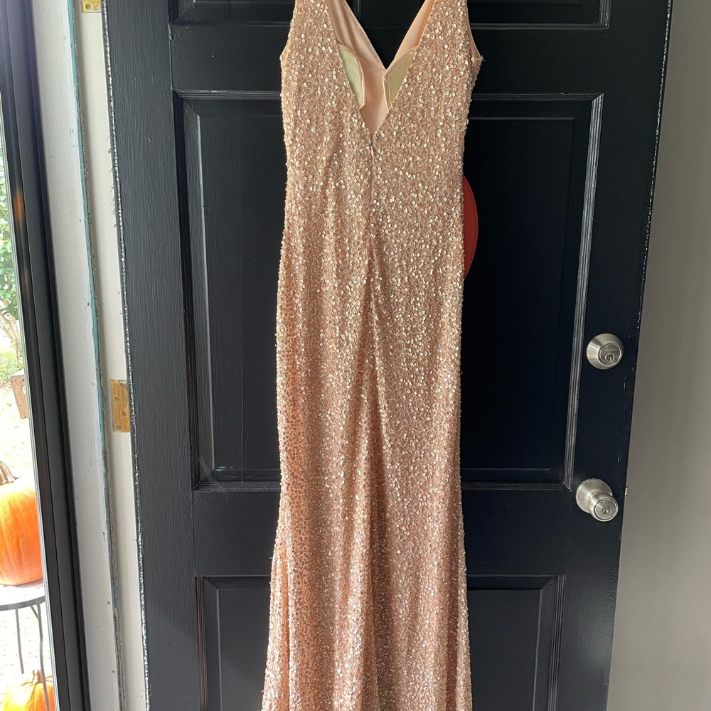 Long gold sequin gown. Fits well with front slit. MacDuggal worn once